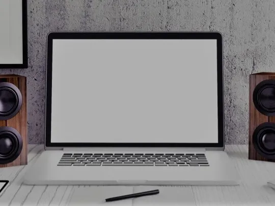 Modern computer with two speakers.