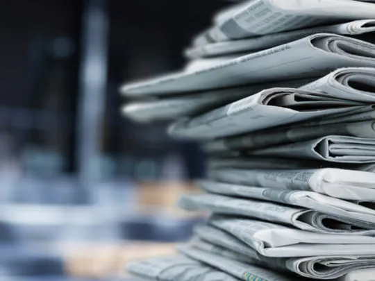 A stack of newspapers folded on top of each other.
