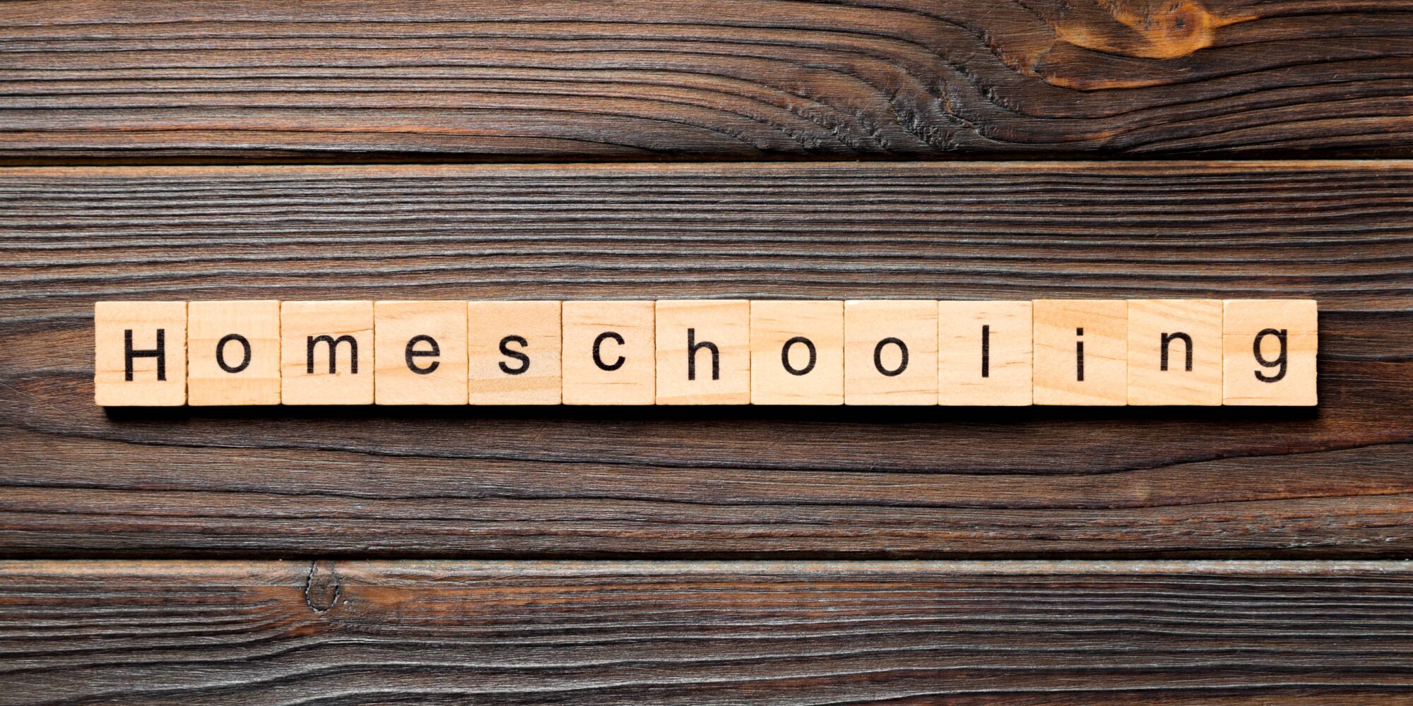 Homeschooling spelled out on wooden letters. 