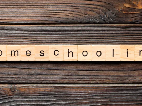 Homeschooling spelled out on wooden letters.