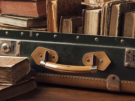 A suitcase with books inside.