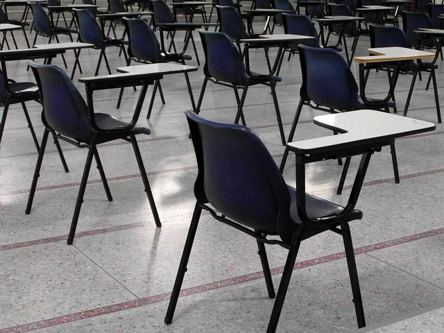 Chairs and desks in an exam hall. 