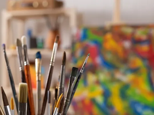 A pot of paintbrushes.