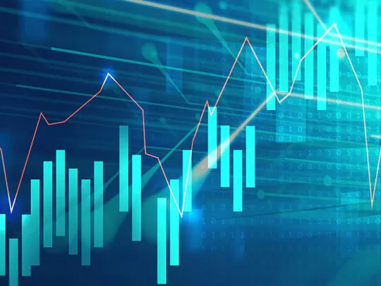 An abstract digital image shows financial graphs and bar charts in shades of blue and turquoise, with lines of code in the background, representing business management and data analysis.