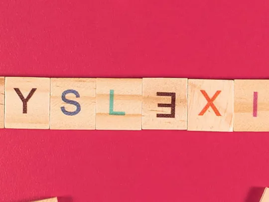 Dyslexia spelled out using wooden letters.