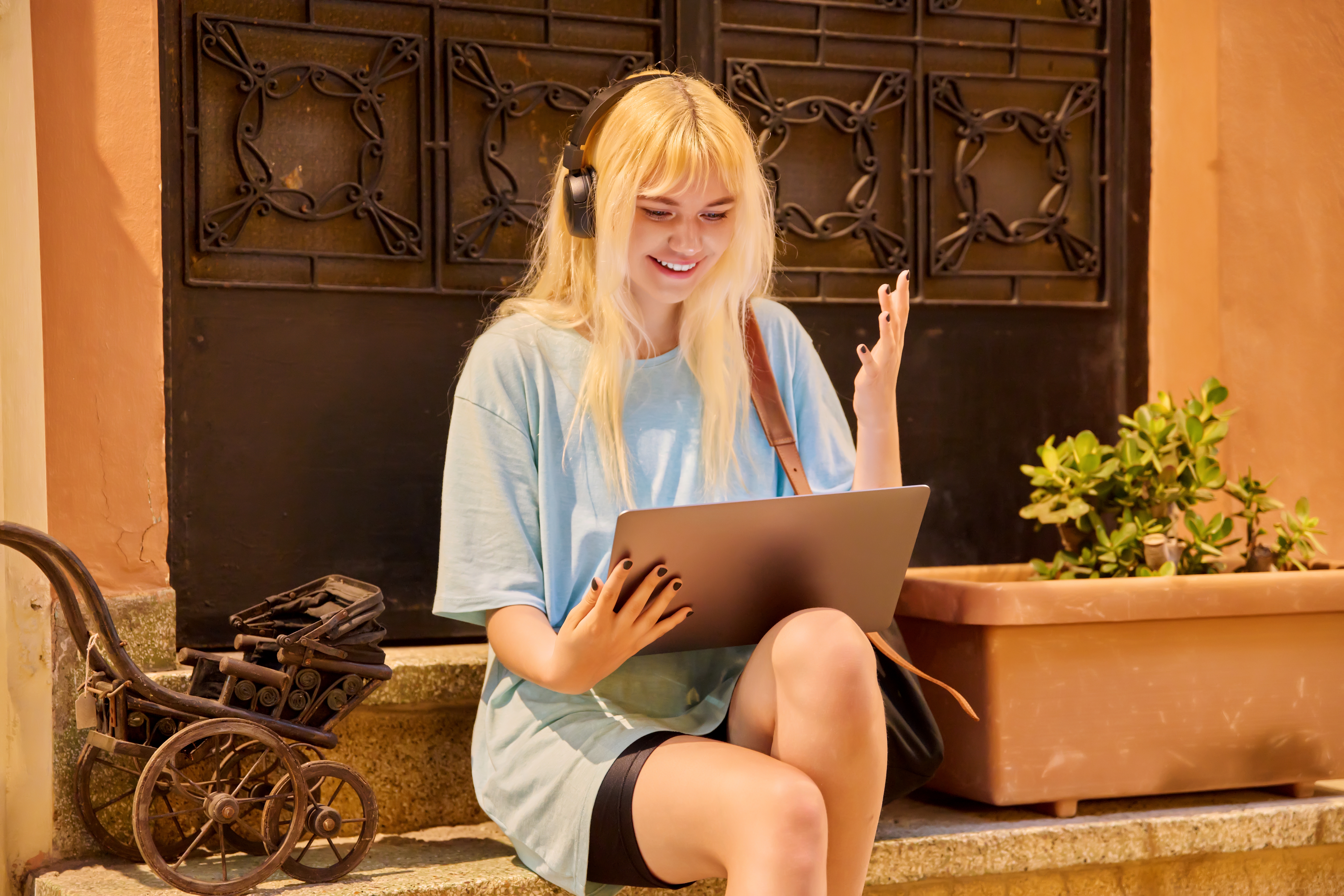 A blurry, long-exposure photo of business people in motion walking down a modern, white, brightly-lit corporate walkway, symbolizing the fast pace of business management.
