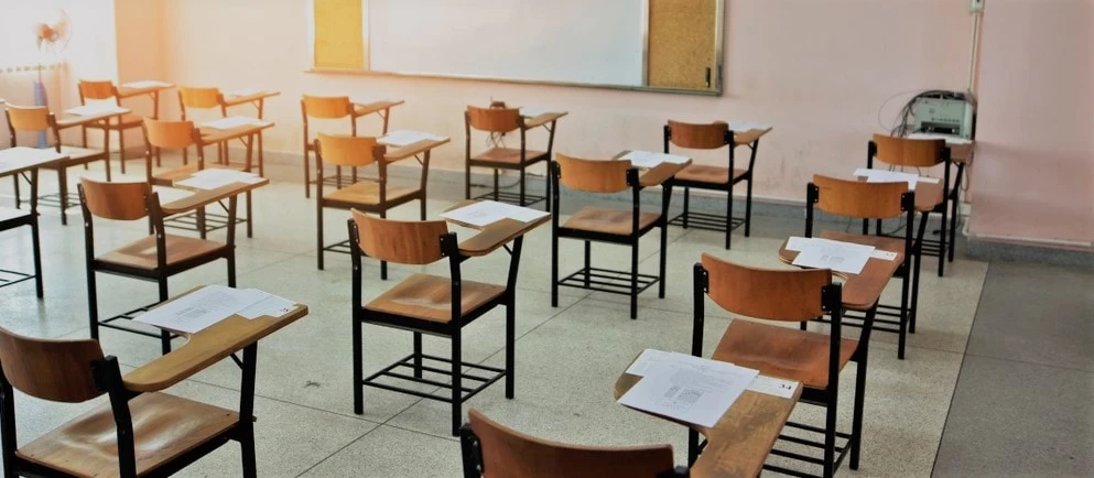 Desks and chairs in an exam centre.