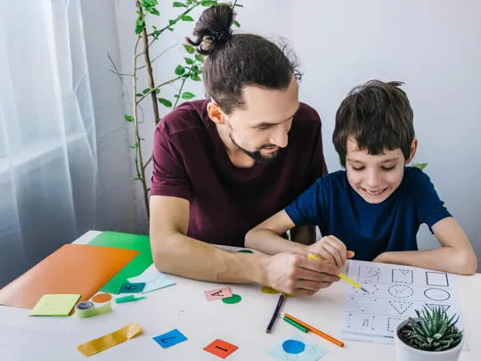 Father and son learning about shapes.