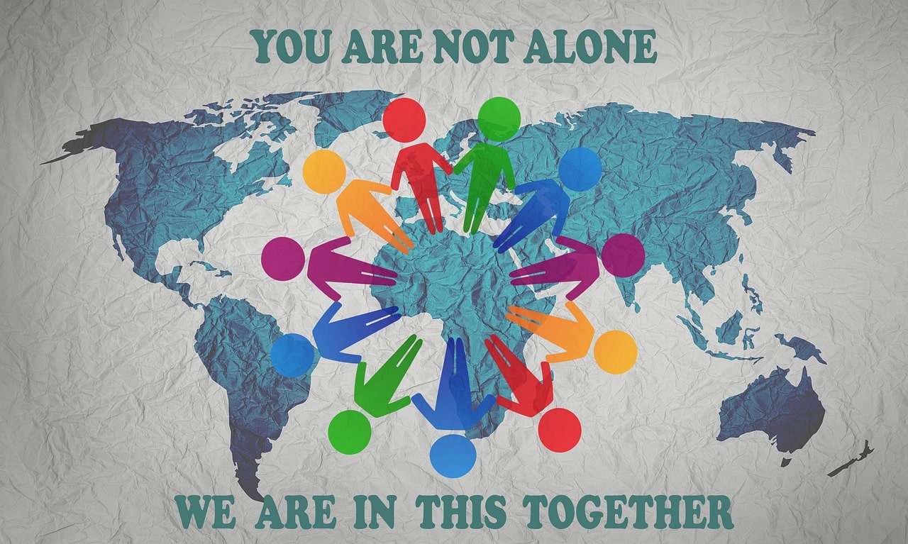 A poster that reads; 'You are not alone, we are in this together'. 