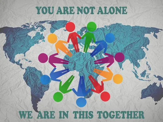 A poster that reads; 'You are not alone, we are in this together'.